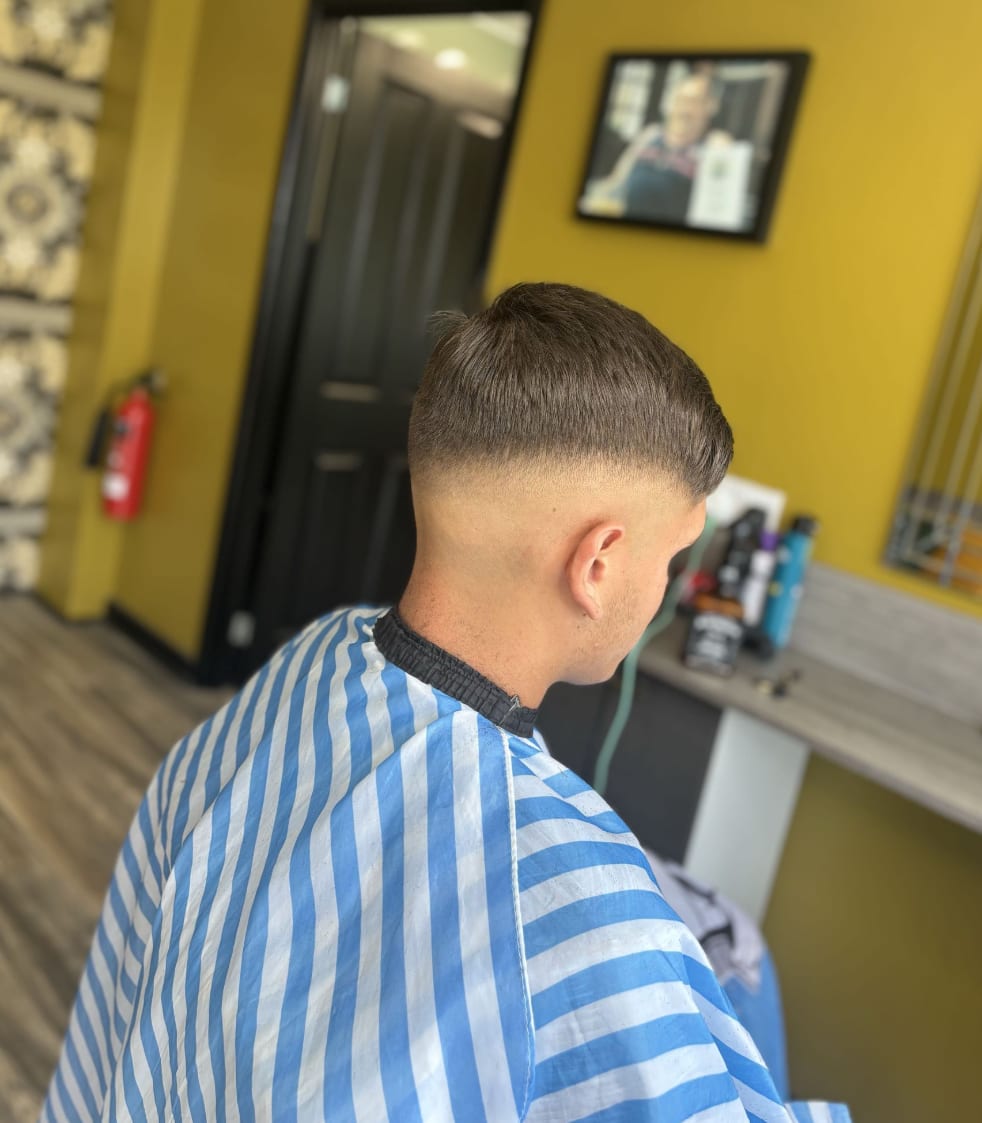 A textured crop with a mid skin fade