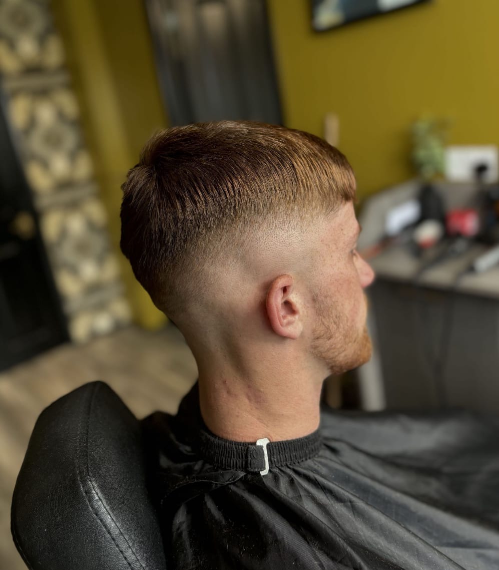 A crop with a high skin fade, freshly cut at Kennedys