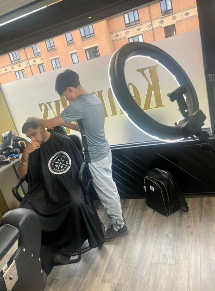 A client being styled in the chair at Kennedys